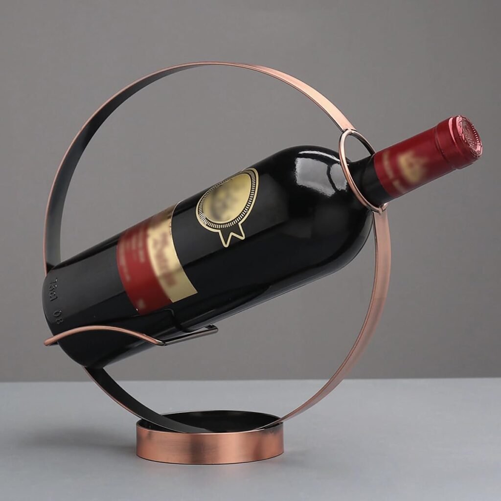 Red wine bottle in a copper-colored circular wine rack