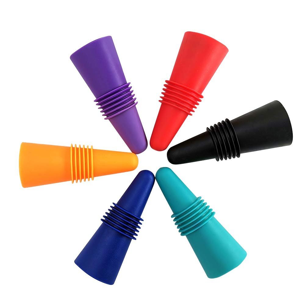 Six colorful wine bottle stoppers arranged in a circle on a white background