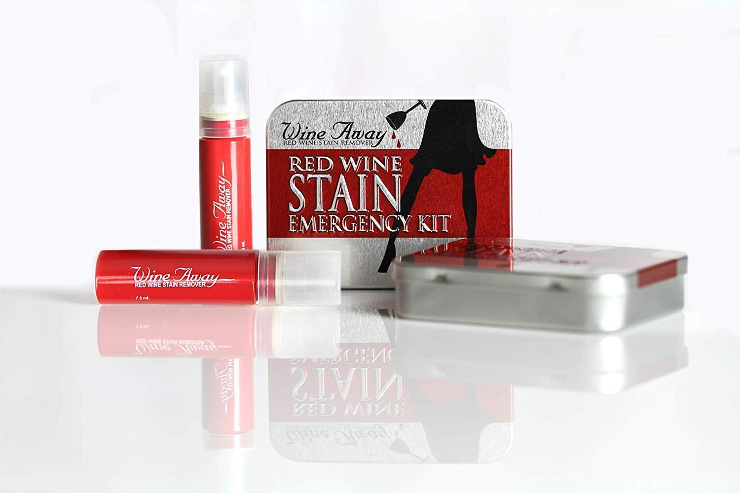 Wine Away red wine stain remover products and emergency kit on reflective surface