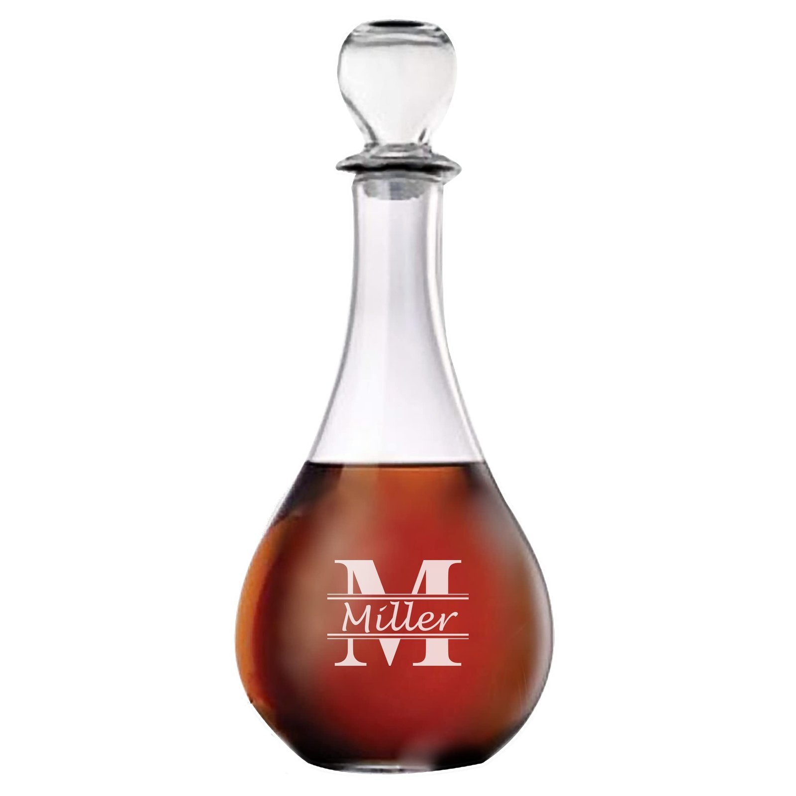 Glass decanter filled with amber liquid, etched with "Miller" and a large "M"