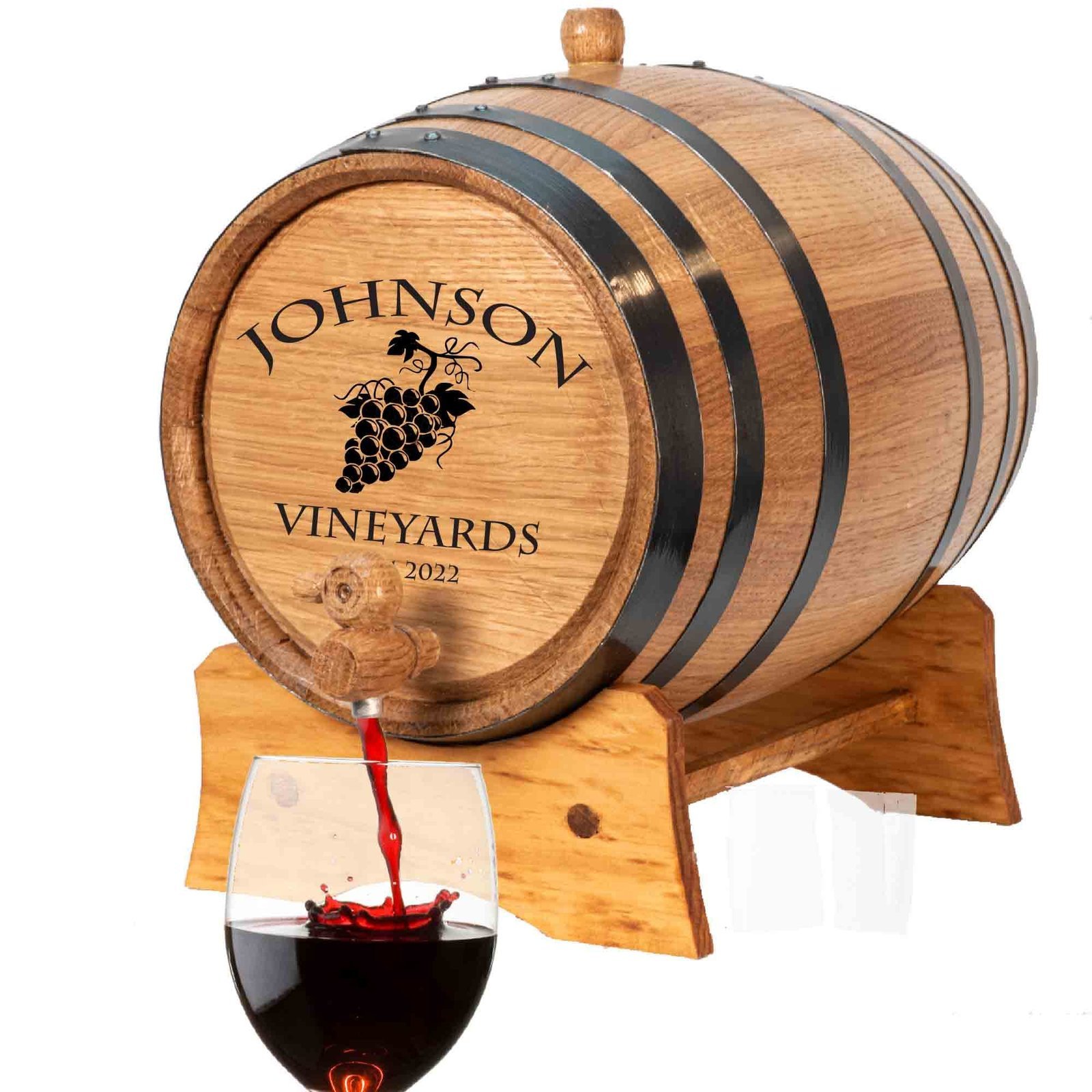 Wooden wine barrel with a glass being filled with red wine