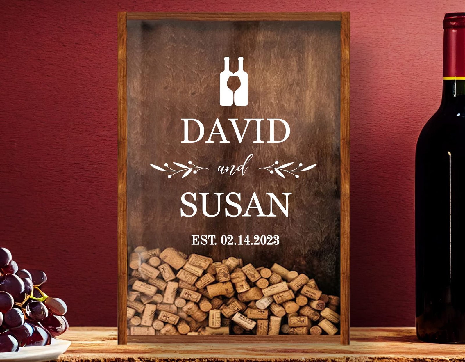 Wooden framed sign with names "David and Susan" and wine corks