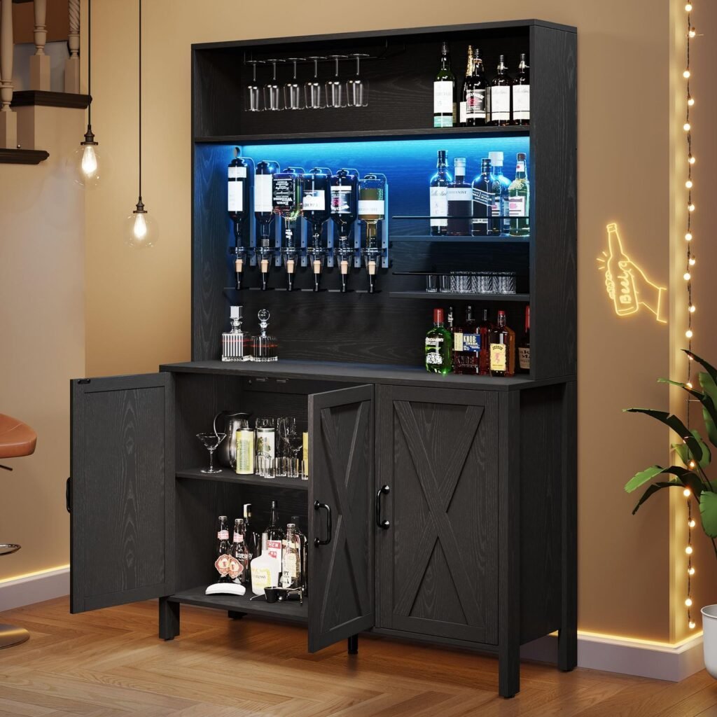 Black home bar cabinet with liquor bottles, glasses, and neon "beer" sign