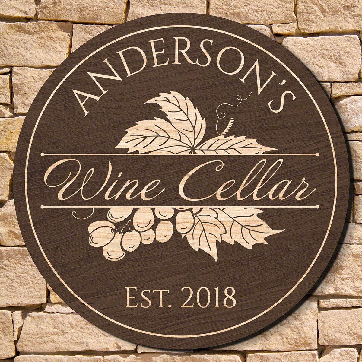 Round wooden sign for Anderson's Wine Cellar, with grape and leaf design