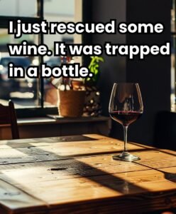 Glass of red wine on a wooden table with the text: 'I just rescued some wine